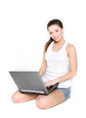 Fototapeta premium young beautiful girl with laptop over white