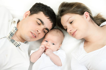happy family - mother, father and baby