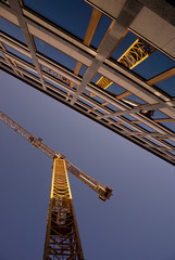 Fototapeta na wymiar reflection of a crane in an office building