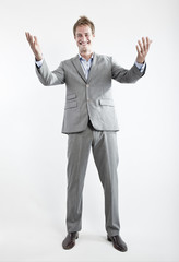 business man in grey suit on white background in studio