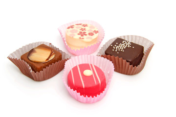 Delicious petit four over white background