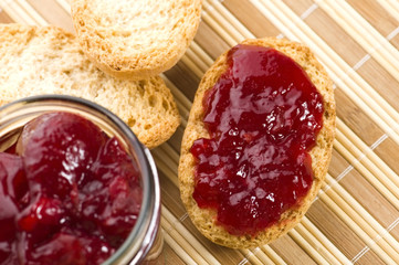 Breakfast of cherry jam on toast.