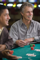 Men Gambling Playing Cards in Las Vegas