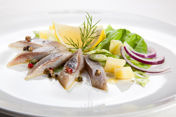 Marinated herring fillets with vegetables