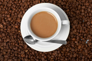 Cup with coffee, costing on coffee grain