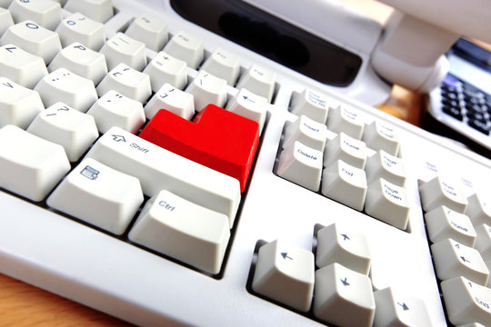 Keyboard with red button in work place