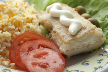 Fried flounder with rice and vegetables