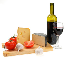 cheese, garlic, tomato on a board