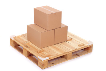 cardboard boxes on wooden palette