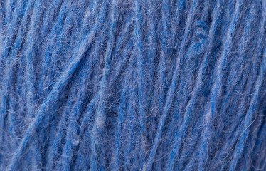 Close-up With a dark blue woollen thread