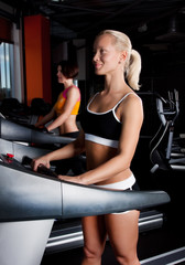 Fototapeta na wymiar Tho athletes on treadmill