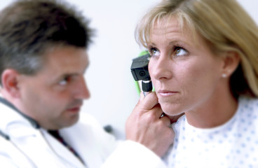 Physician examining patient