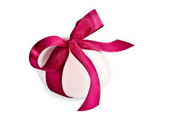 Egg decorated with a  tape, on a white background