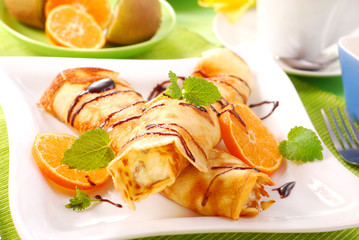 rolled pancakes with  cottage cheese and orange