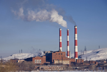 Fototapeta na wymiar Factory with smoking chimneys