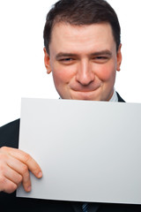 Closeup Portrait of a Young Businessman Holding a Blank Billboar