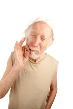 Senior Man Smoking Cigarette Or Marijuana