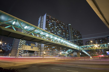Fototapeta na wymiar Hong Kong traffic in front of public housing apartment block