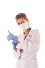 Female doctor putting onthe gloves