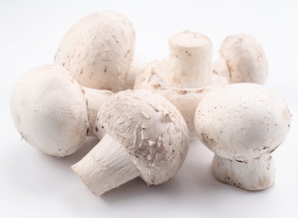 Handful of champignons on a white background