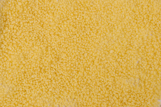 Fond et arri&egrave;re plan de semoule de bl&eacute; jaune &agrave; couscous