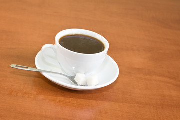 white cup of coffee on the table