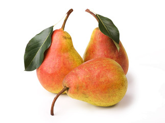 Ripe pears with leaves on white background