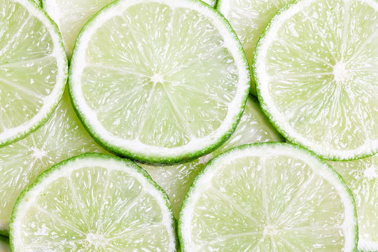 Green lime slices close-up background