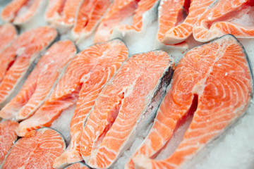 Salmon steaks on cooled market display