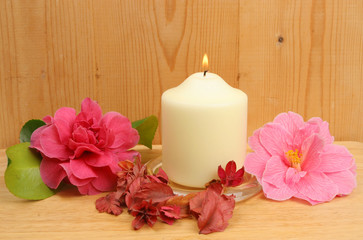 Obraz na płótnie Canvas Candle and camellia flowers