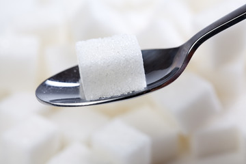 sugar cube on spoon