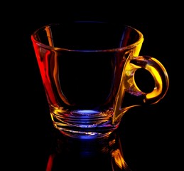 Glass cup on a black background