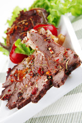 beef meat slices on ceramic plate