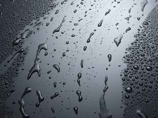 Wassertropfen auf schwarz glänzendem Hintergrund