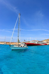boat and ferry at blue lagoon in malta