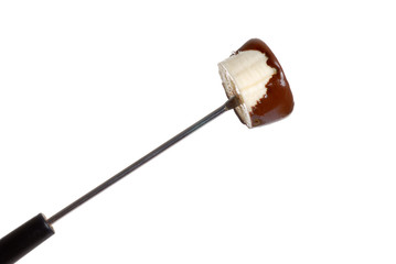 chocolate covered banana on fondue stick