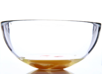 Cracked eggs in a glass bowl