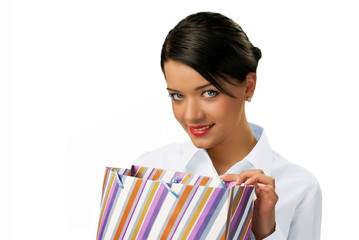 Attractive brunette peeping into paper bag isolated