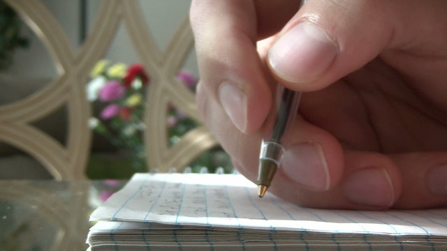 Close up of hand writing