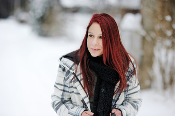 Young woman in snowy forest