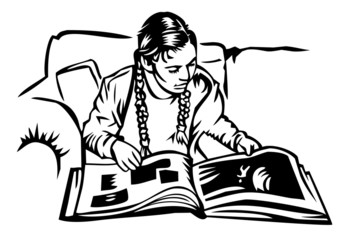 girl on couch looking at picture book