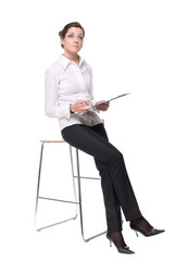 Portrait of young emotional business woman on chair