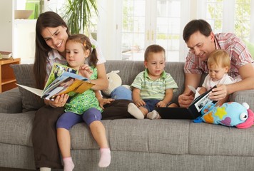 Parents and children having fun at home