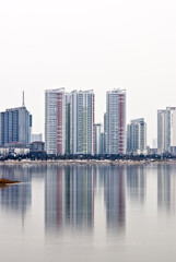 Fototapeta na wymiar New city of Modern China reflected in the water