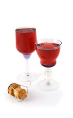 Blue glasses with champagne cork and red wine
