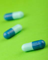 set capsules on green background