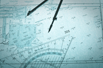 blue backlit surveyor's plan, circle and set square