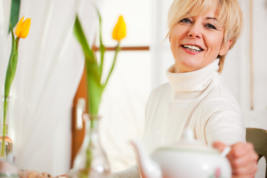 Woman Grabbing Coffee Or Tea Pot