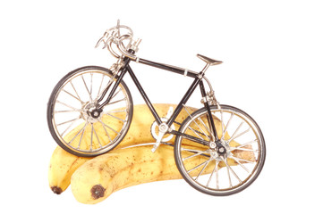 Fototapeta na wymiar Toy bike standing on the fruits