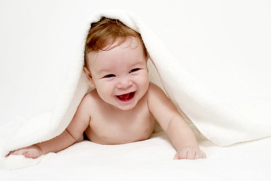 Portrait of the little boy under a terry towel